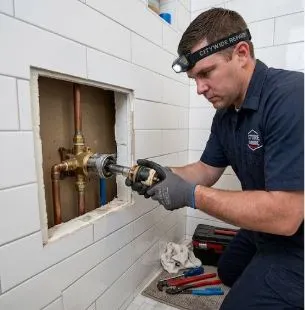Shower valve cartridge repair Montreal — plumber replacing worn shower valve cartridge
